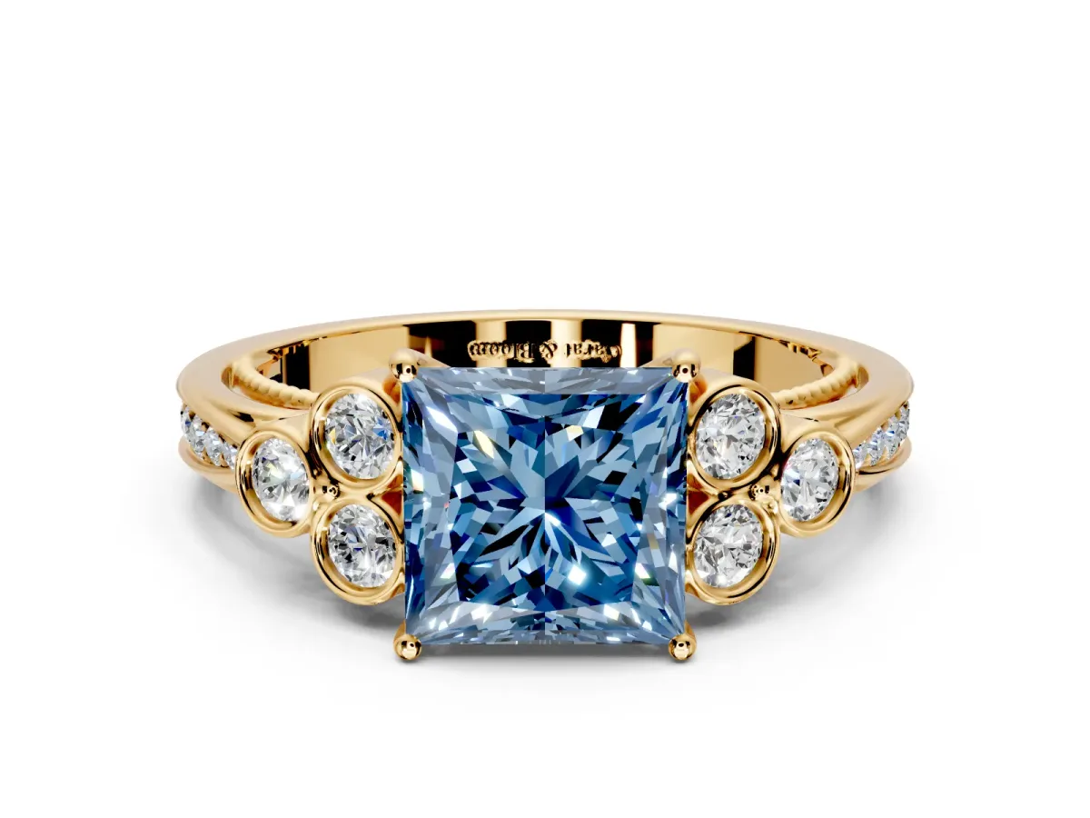 Cluster Engagement Ring Setting for Fancy Blue Princess Cut Center with Bezel Accent Clusters and Prong Head in Yellow Gold