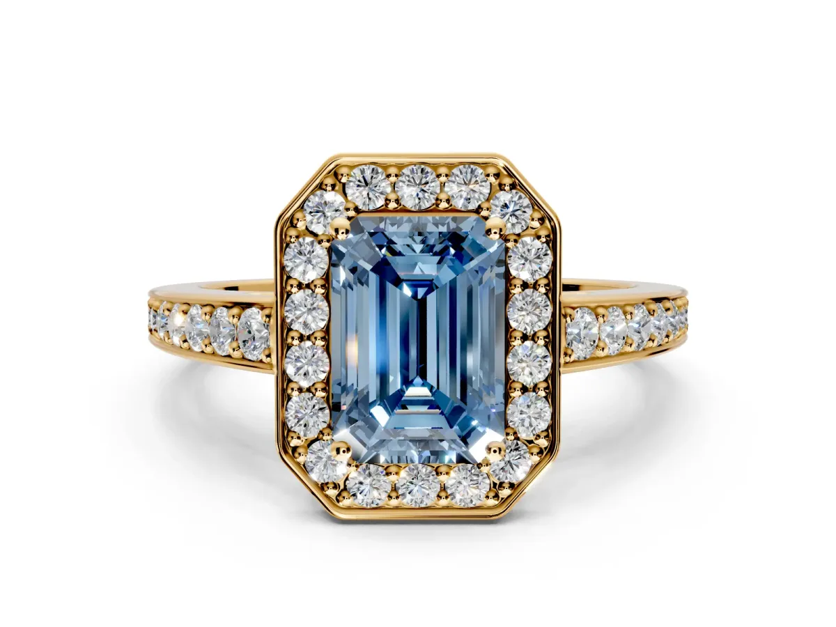 Bezel-Framed Halo Engagement Ring Setting for Fancy Blue Emerald Cut Center with Pave Band and Prong Head in Yellow Gold