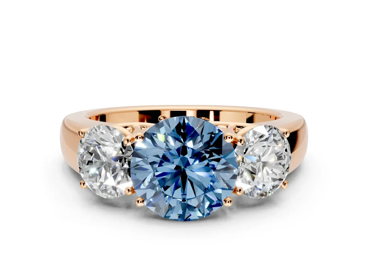 3 Stone Engagement Ring Setting for Fancy Blue Round Cut Center with Raised Basket Heads and Prong Head in Rose Gold