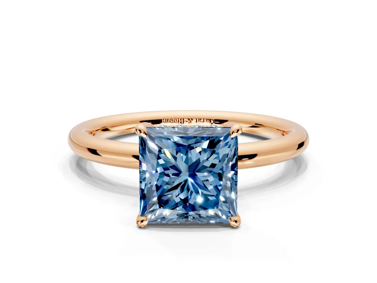 Hidden Halo Engagement Ring Setting for Fancy Blue Princess Cut Center with Thin Rounded Band and Prong Head in Rose Gold