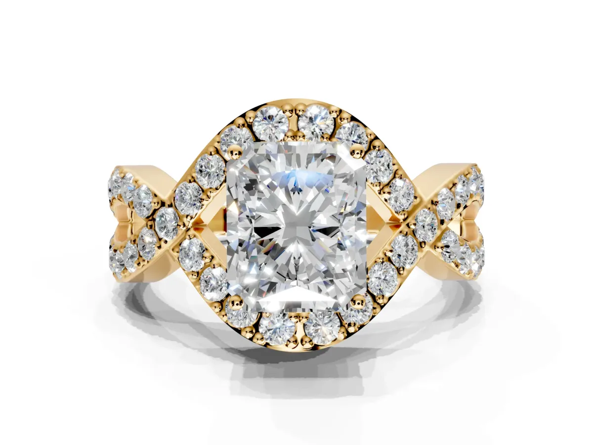 Halo Engagement Ring Setting for Radiant Cut Center with Pave Infinity Twist Band and Prong Head in Yellow Gold