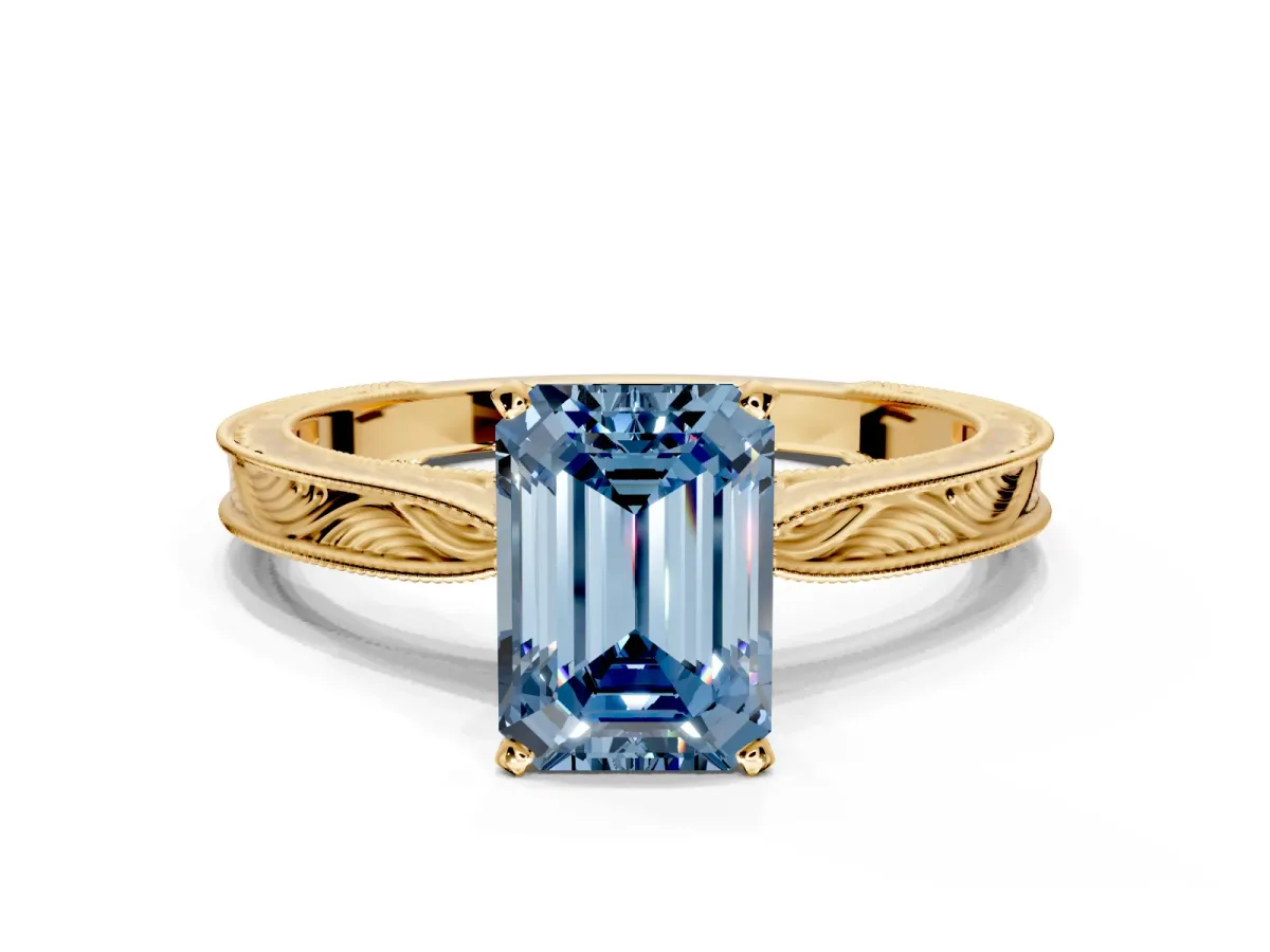 Solitaire Engagement Ring Setting for Fancy Blue Emerald Cut Center with Engraved Milgrain Band and Prong Head in Yellow Gold
