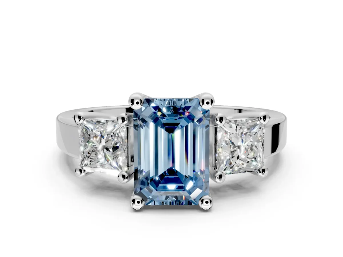 3 Stone Engagement Ring Setting for Fancy Blue Emerald Cut Center with Matching Side Accents and Prong Head in Platinum