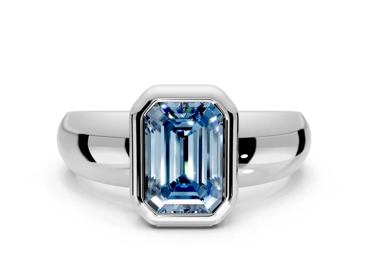Solitaire Engagement Ring Setting for Fancy Blue Emerald Cut Center with Wide Band and Bezel Head in White Gold
