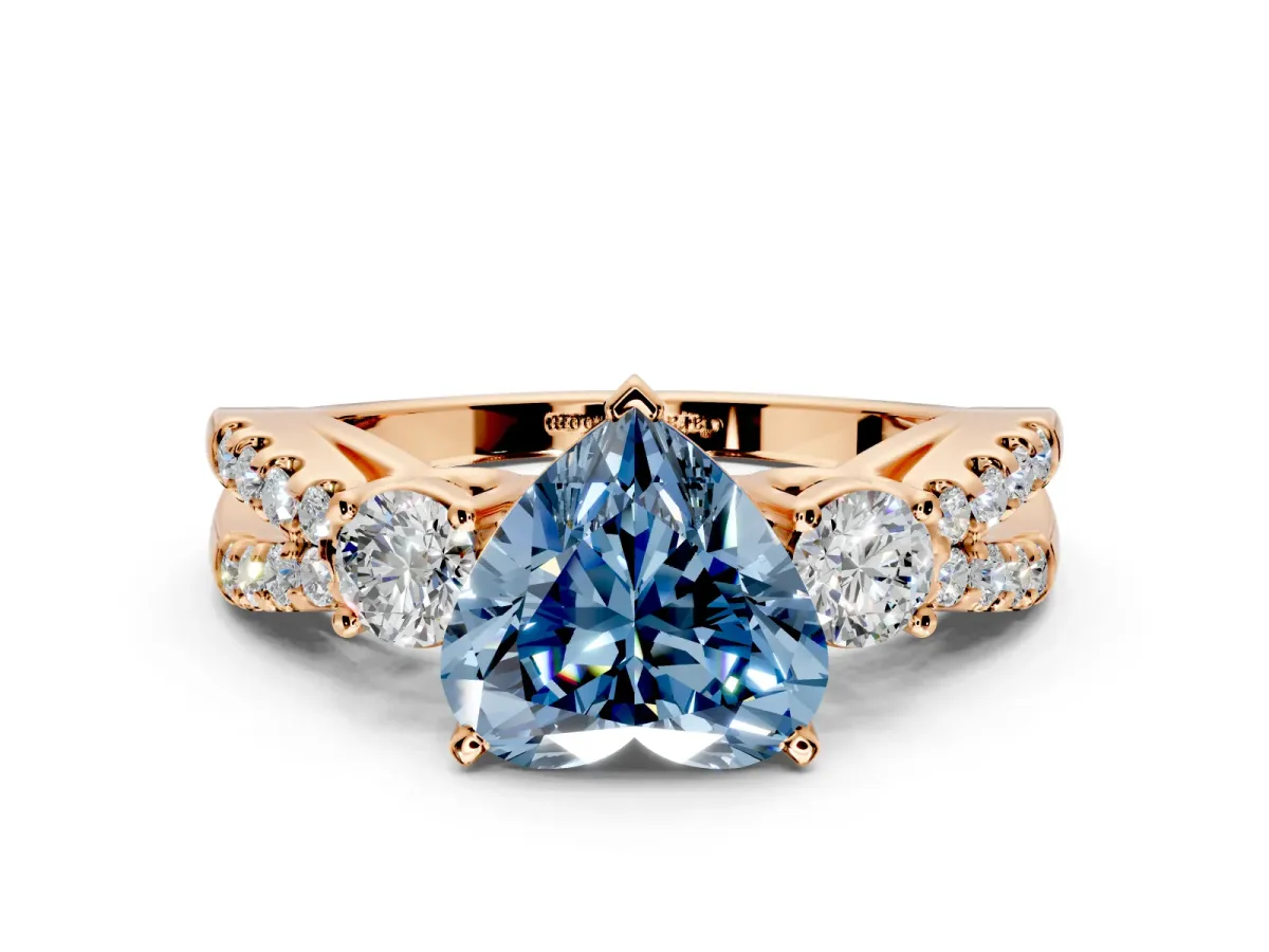 3 Stone Engagement Ring Setting for Fancy Blue Heart-Shaped Center with Pave Split Shank and Prong Head in Rose Gold