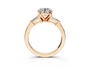 3 Stone Engagement Ring Setting for Round Cut Center with Channel Baguette Accents and Prong Head in Rose Gold
