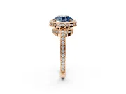 Halo Engagement Ring Setting for Fancy Blue Round Cut Center with Metal-Rimmed Halo, Pave Band and Prong Head in Rose Gold