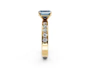 Solitaire Engagement Ring Setting for Fancy Blue Asscher Cut Center with Channel-Set Accents and Prong Head in Yellow Gold