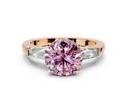 3 Stone Engagement Ring Setting for Fancy Pink Round Cut Center with Tapered Baguettes, Plain Band and Prong Head in Rose Gold