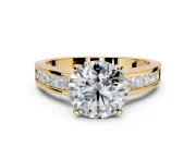 Solitaire Engagement Ring Setting for Round Cut Center with Princess Cut Channel Band and Prong Head in Yellow Gold