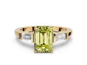 3 Stone Engagement Ring Setting for Fancy Yellow Emerald Cut Center with Channel Baguette Accents and Prong Head in Yellow Gold