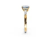 3 Stone Engagement Ring Setting for Fancy Blue Princess Cut Center with Tapered Baguettes, Plain Band and Prong Head in Yellow Gold