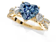 3 Stone Engagement Ring Setting for Fancy Blue Heart-Shaped Center with Pave Split Shank and Prong Head in Yellow Gold