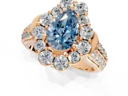 Large Accent Halo Engagement Ring Setting for Fancy Blue Pear-Shaped Center with Pave Split Shank and Prong Head in Rose Gold