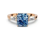 3 Stone Engagement Ring Setting for Fancy Blue Radiant Cut Center with Baguette Accents and Prong Head in Rose Gold