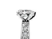Solitaire Engagement Ring Setting for Pear-Shaped Center with Channel-Set Accents and Prong Head in Platinum