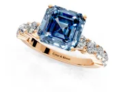 Shared-Prong Engagement Ring Setting for Fancy Blue Asscher Cut Center with Graduated Accents and Prong Head in Rose Gold