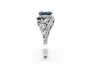 Halo Engagement Ring Setting for Fancy Blue Emerald Cut Center with Marquise and Pave Bypass Band and Prong Head in White Gold