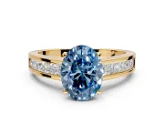 Solitaire Engagement Ring Setting for Fancy Blue Oval Center with Princess Cut Channel Band and Prong Head in Yellow Gold
