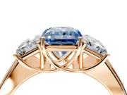 3 Stone Engagement Ring Setting for Fancy Blue Radiant Cut Center with Raised Basket Heads and Prong Head in Rose Gold