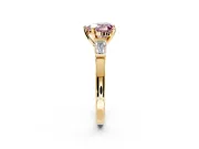 3 Stone Engagement Ring Setting for Fancy Pink Heart-Shaped Center with Channel Baguette Accents and Prong Head in Yellow Gold