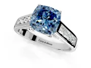 Solitaire Engagement Ring Setting for Fancy Blue Cushion Cut Center with Round Cut Channel Band and Prong Head in White Gold
