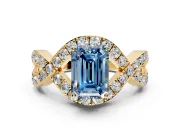 Halo Engagement Ring Setting for Fancy Blue Emerald Cut Center with Pave Infinity Twist Band and Prong Head in Yellow Gold