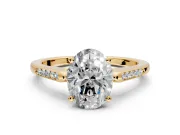Solitaire Engagement Ring Setting for Oval Center with Channel Accents and Prong Head in Yellow Gold