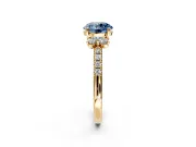 Paired Accent Engagement Ring Setting for Fancy Blue Round Cut Center with Pave Band and Prong Head in Yellow Gold
