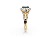 Halo Engagement Ring Setting for Fancy Blue Emerald Cut Center with Two-Strand Split Shank and Prong Head in Yellow Gold