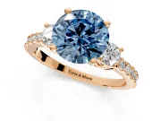 3 Stone Engagement Ring Setting for Fancy Blue Round Cut Center with Round Cut Side Accents and Prong Head in Rose Gold