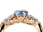 Cluster Engagement Ring Setting for Fancy Blue Oval Center with Round Cut Accent Frame and Prong Head in Rose Gold