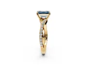 Crossover Engagement Ring Setting for Fancy Blue Emerald Cut Center with Pave and Plain Strands and Prong Head in Yellow Gold