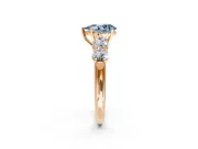 5 Stone Engagement Ring Setting for Fancy Blue Pear-Shaped Center with Graduated Accents and Prong Head in Rose Gold