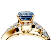 Halo Engagement Ring Setting for Fancy Blue Radiant Cut Center with Marquise and Pave Bypass Band and Prong Head in Yellow Gold