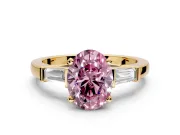 3 Stone Engagement Ring Setting for Fancy Pink Oval Center with Channel Baguette Accents and Prong Head in Yellow Gold