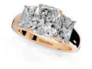 3 Stone Engagement Ring Setting for Radiant Cut Center with Raised Basket Heads and Prong Head in Rose Gold