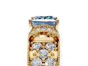 Pave Engagement Ring Setting for Fancy Blue Princess Cut Center with Curved Accent Rows, Openwork and Prong Head in Yellow Gold