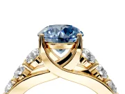 Solitaire Engagement Ring Setting for Fancy Blue Round Cut Center with Graduated Shared Prongs and Prong Head in Yellow Gold