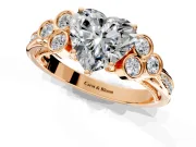 Cluster Engagement Ring Setting for Heart-Shaped Center with Bezel Accent Clusters and Prong Head in Rose Gold