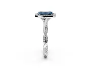 Halo Engagement Ring Setting for Fancy Blue Emerald Cut Center with Twist Band and Prong Head in Platinum