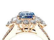 Halo Engagement Ring Setting for Fancy Blue Radiant Cut Center with Two-Strand Split Shank and Prong Head in Rose Gold