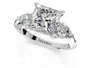 3 Stone Engagement Ring Setting for Princess Cut Center with Large Pear-Shaped Accents and Prong Head in Platinum