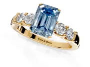 5 Stone Engagement Ring Setting for Fancy Blue Emerald Cut Center with Plain Band and Prong Head in Yellow Gold