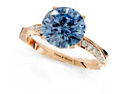 Side Accent Engagement Ring Setting for Fancy Blue Round Cut Center with Accent Shoulders and Prong Head in Rose Gold
