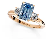 3 Stone Engagement Ring Setting for Fancy Blue Emerald Cut Center with Wide Plain Band and Prong Head in Rose Gold