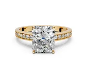 Solitaire Engagement Ring Setting for Radiant Cut Center with Channel-Set Accent Band and Prong Head in Yellow Gold