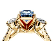 3 Stone Engagement Ring Setting for Fancy Blue Emerald Cut Center with Crossover Basket, Pave Band and Prong Head in Yellow Gold
