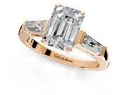 3 Stone Engagement Ring Setting for Emerald Cut Center with Tapered Baguettes, Plain Band and Prong Head in Rose Gold