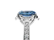 Floral Engagement Ring Setting for Fancy Blue Emerald Cut Center with Four Accent Clusters and Prong Head in White Gold